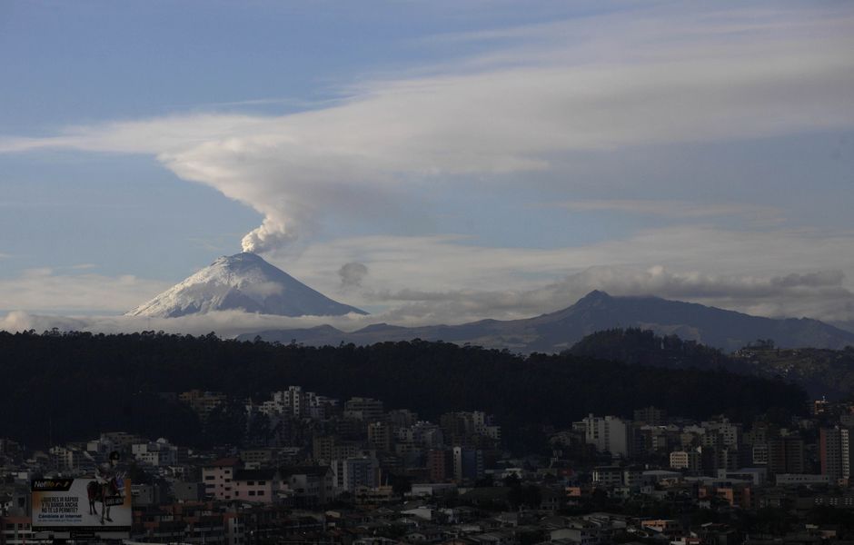 The Cotopaxi volcano spews ash and vapor, seen from Quito, Ecuador, Monday, Oct. 19, 2015. Cotopaxi began showing renewed activity in April and its last major eruption was in 1877. (AP Photo/Dolores Ochoa) ORG XMIT: DOR101