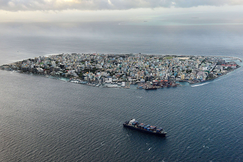 (FILES) This photograph taken on September 9, 2013, shows an aerial view of the island of Male, the capital of the Maldives. Maldives President Abdulla Yameen declared a state of emergency on November 3, 2015, giving sweeping powers to security forces to arrest suspects ahead of a major anti-government protest rally, his spokesman said. The move came two days ahead of a planned protest by the main opposition Maldivian Democratic Party (MDP), whose leader Mohamed Nasheed is in jail after a widely criticised conviction under anti-terror laws. AFP PHOTO/ Roberto SCHMIDT/FILES ORG XMIT: RAS002